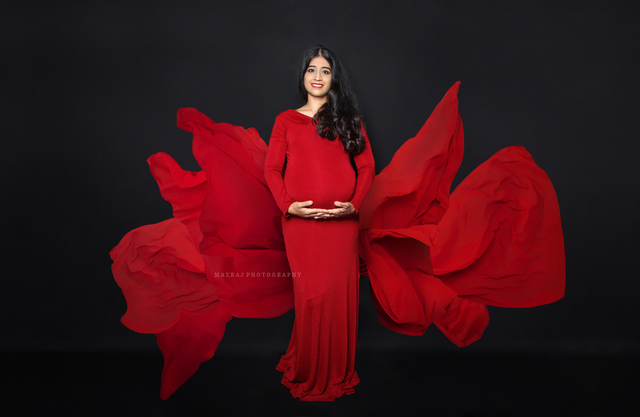 maternity photographer in pune, maternity photoshoot in red gown in pune city